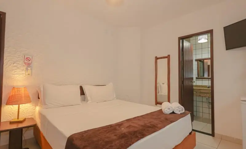 Foto da cama da suíte standard